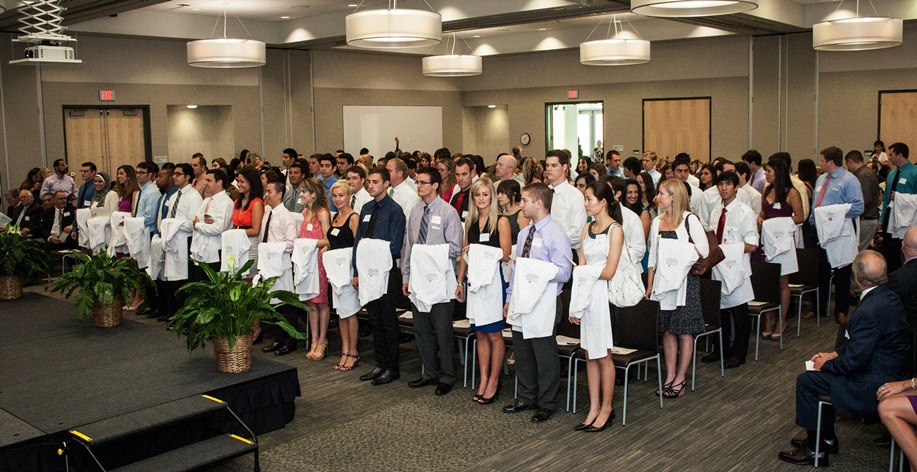 Large group of healthcare professional students at a white coat ceremony