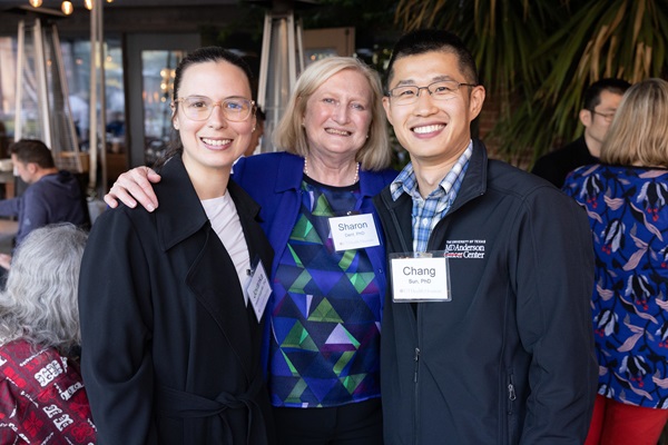 Three MD Anderson Graduate School alumni at an event