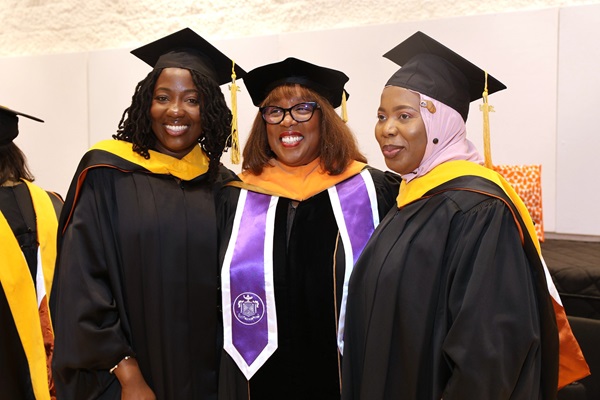 Three McWilliams School of Biomedical Informatics graduates at commencement