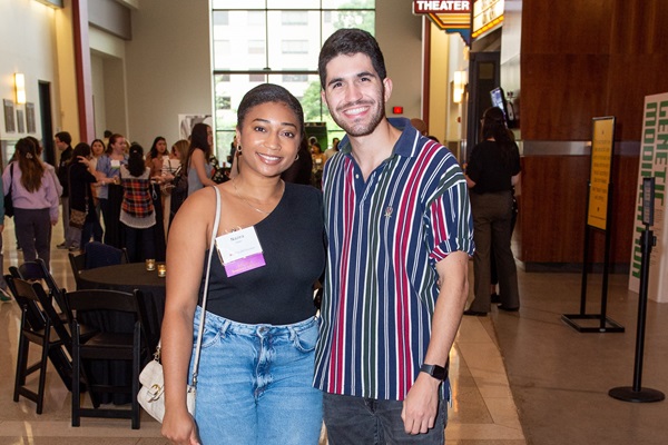 Two students attending an alumni event