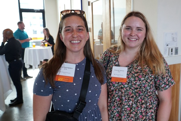 Two School of Public Health alumna at an alumni event