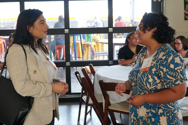 Two UTHealth Houston alumni talking at an alumni event