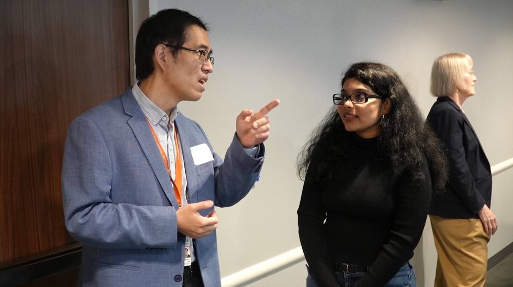 McWilliams School of Biomedical Informatics faculty member talking with a female student