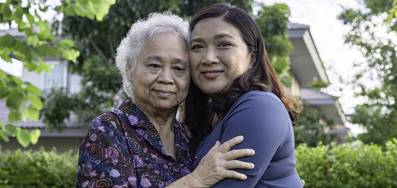 Older woman and younger woman hugging. Photo courtesy Getty Images.